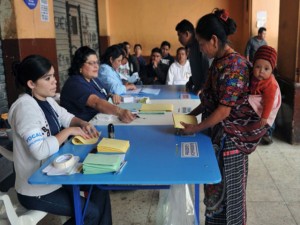 An indigenous woman prepares to cast her vote during presidential elections, in San Juan Sacatepequez 32 km west of Guatemala City, on September 11, 2011. Polls opened as Guatemalans elect a new president from among 10 contenders, with a former army general who served during the country's "dirty war" in the 1980s heavily tipped to win. Pre-election surveys showed ex-general Otto Perez Molina from the Patriotic Party some 20 points ahead of his nearest rival, but he is unlikely to win the 50 percent-plus-one necessary to avoid a run-off vote in November.  AFP PHOTO/Rodrigo ARANGUA